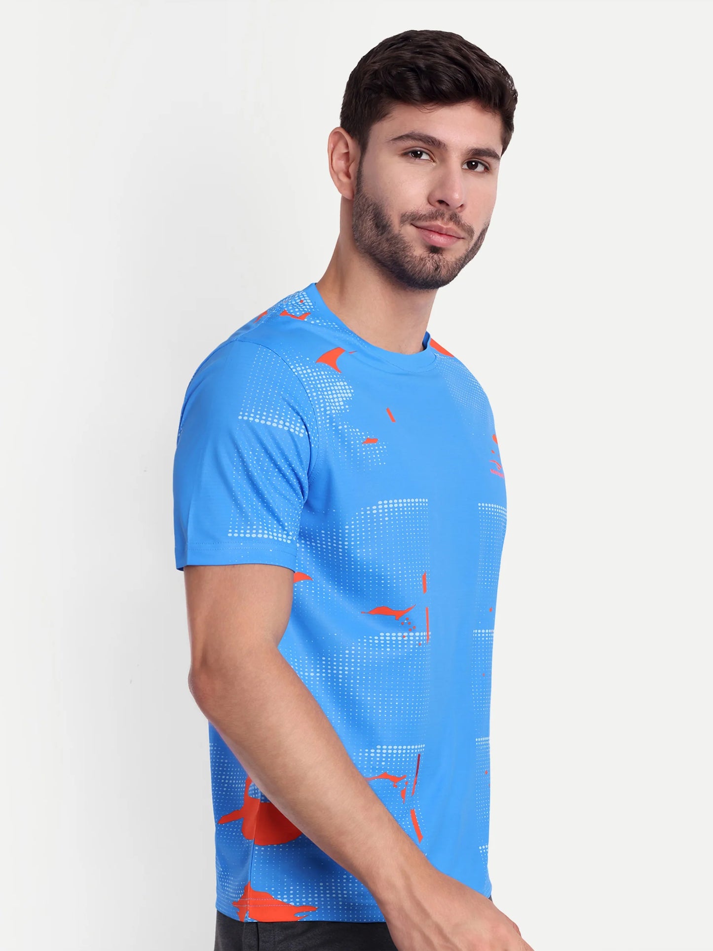 Man wearing a blue athletic shirt with orange accents on a white background