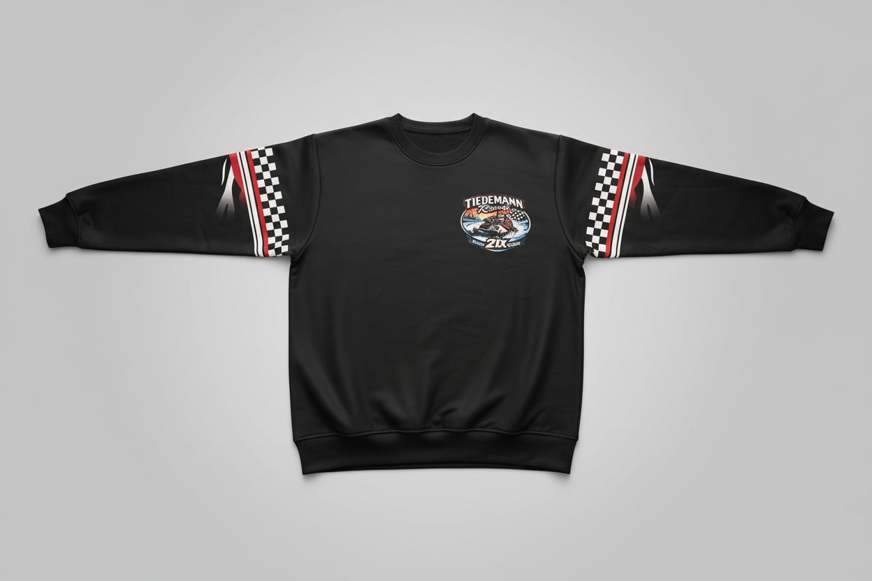 Black hoodie with a logo on a bed