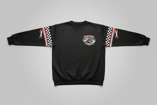 Black hoodie with a logo on a bed